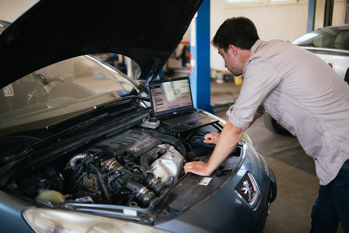 A mechanic running car diagnostics
