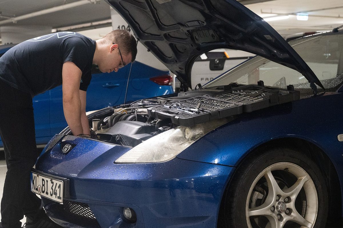 A mechanic inspecting a car engine